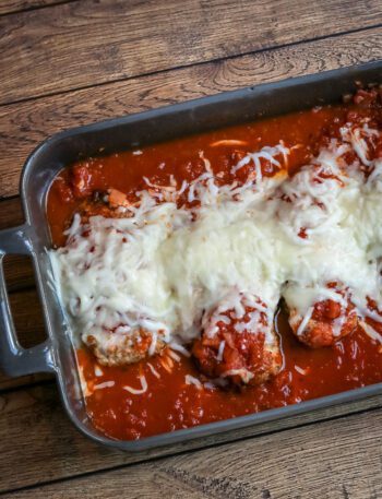 chicken parmigiana in a baking dish