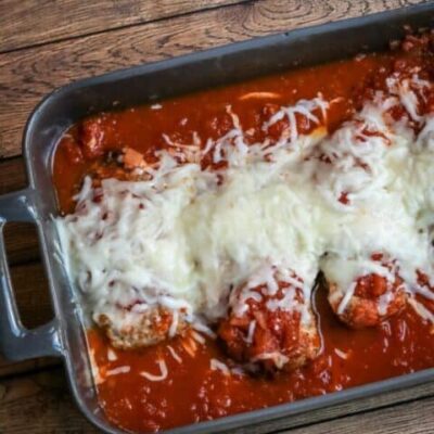 chicken parmigiana in a baking dish