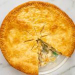 comforting chicken pot pie recipe with a slice cut out