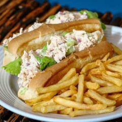 chicken salad sandwiches on buns with French fries on the side