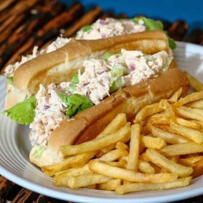 chicken salad sandwiches on buns with French fries on the side