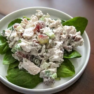 chicken salad with grapes on lettuce leaves