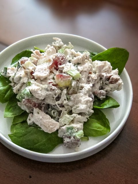 chicken salad with grapes on lettuce leaves