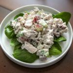 chicken salad with grapes on lettuce leaves