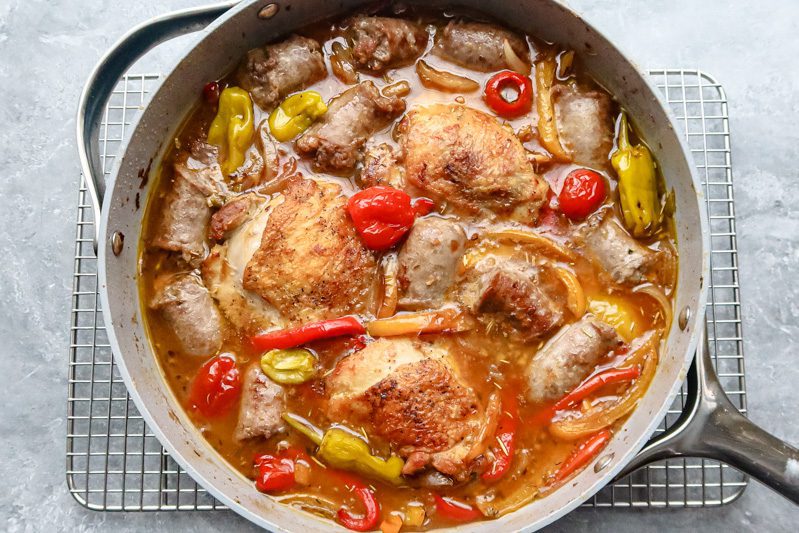 chicken scarpariello with peppers, sausages, chicken thighs, browned then baked in the skillet.