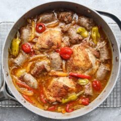 Colorful chicken scarpariello in a skillet.