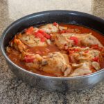 chicken with tomatoes and wine in a skillet