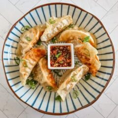 chili crisp dippping sauce with some fried dumplings