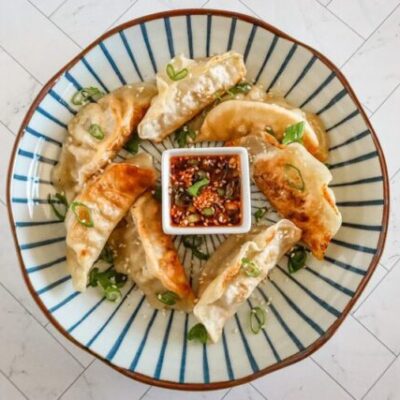 chili crisp dippping sauce with some fried dumplings