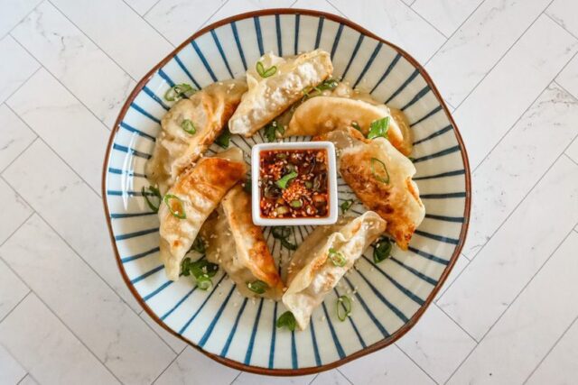 chili crisp dippping sauce with some fried dumplings