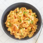 chili crisp shrimp fettuccine alfredo in a bowl