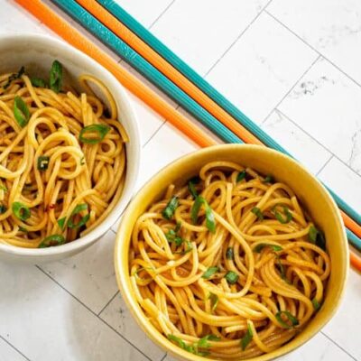 chili garlic noodles in small bowls