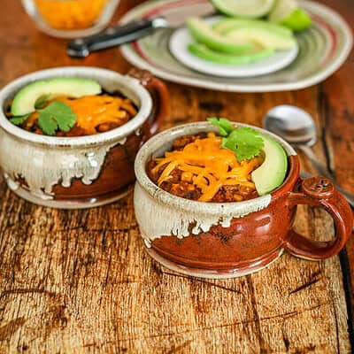 chili in cups with garnishes