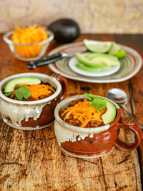 chili in cups with garnishes