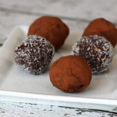 chocolate bourbon truffles on a plate with cocoa or sugar coating