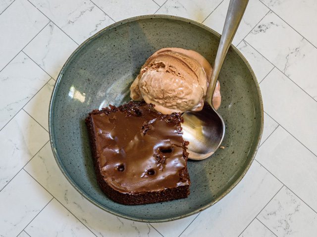 square of chocolate buttermilk cake with ice cream