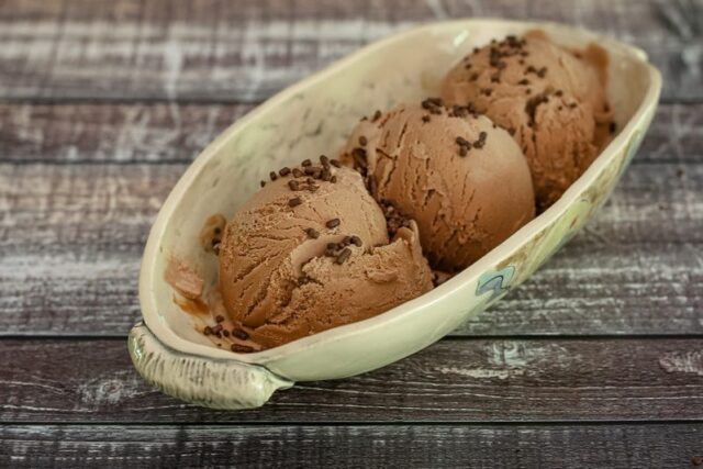 oblong pottery dish with 3 scoops of homemade chocolate ice cream