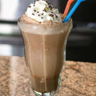 Creamy chocolate milkshake with whipped cream and sprinkles.