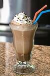 Delicious ice cream soda with whipped cream and sprinkles.