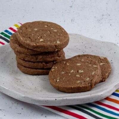 chocolate icebox cookies stacked on a plate