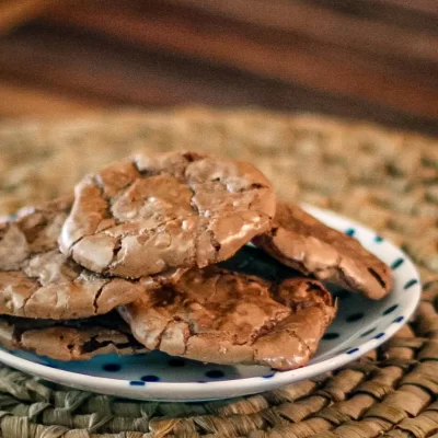 Chocolate chip cookies on a small plate.