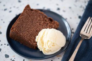 a slice of chocolate pound cake with ice cream