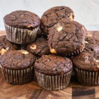 Chocolate zucchini muffins with white chocolate chips, baked and ready to enjoy.