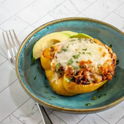 Chorizo stuffed peppers with cheese topping.