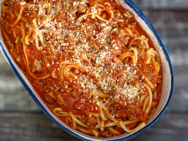 serving dish with bolognese and spaghetti