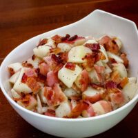 German potato salad in a serving bowl.