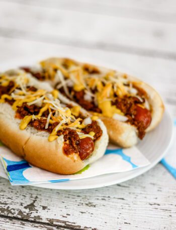 Coney Island hot dog sauce on hot dogs in buns, ready to enjoy.