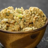 A serving bowl with cornbread and sausage dressing.