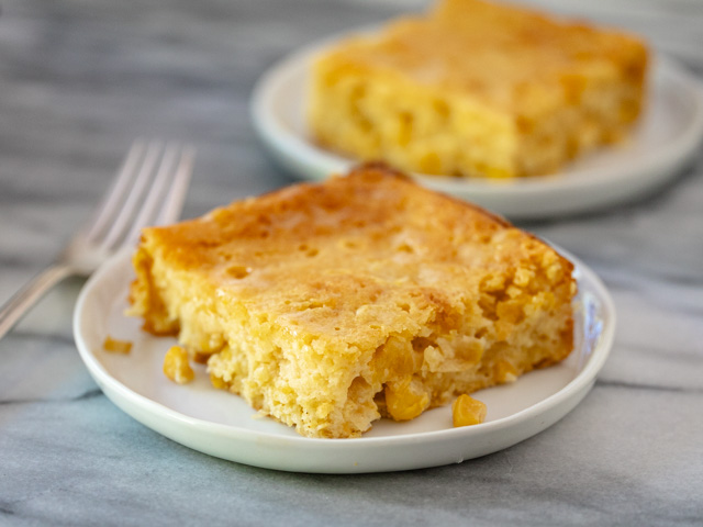 squares of cornbread casserole on plates