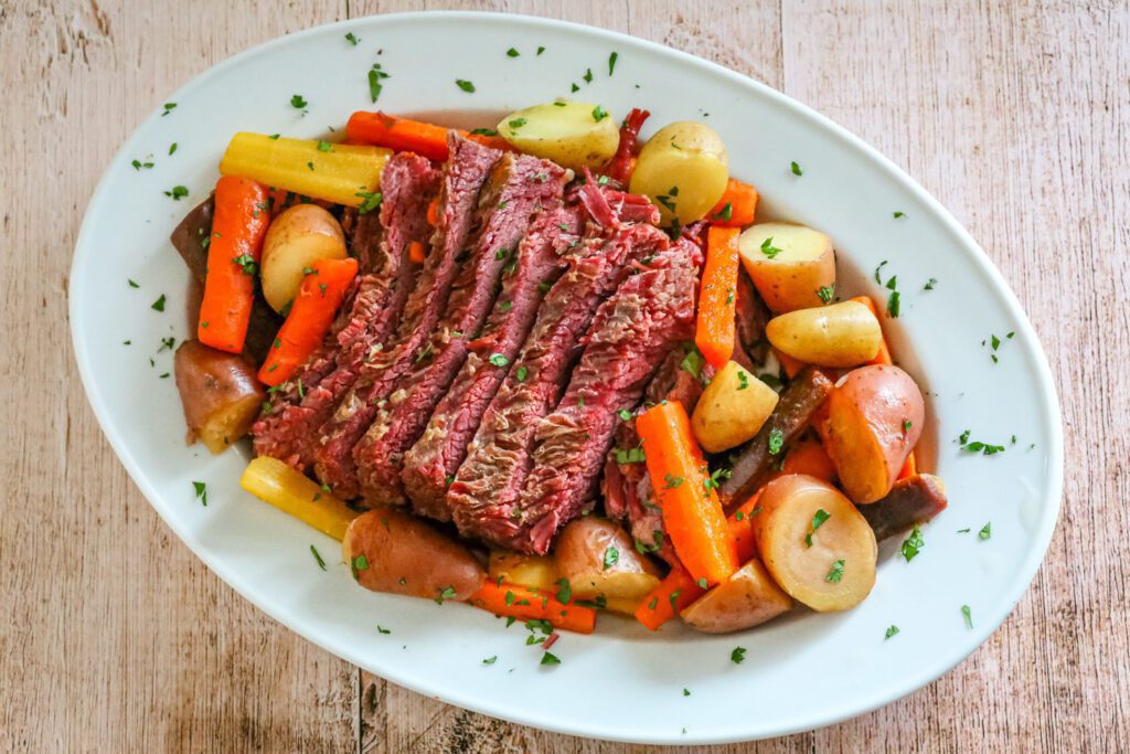 corned beef with vegetables on a serving platter