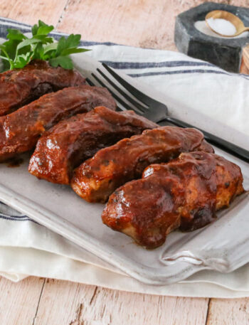 country style ribs with maple bbq sauce on a platter