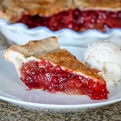 apple cranberry pie slice on a plate