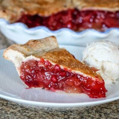 apple cranberry pie slice on a plate