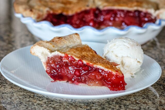 apple cranberry pie slice on a plate