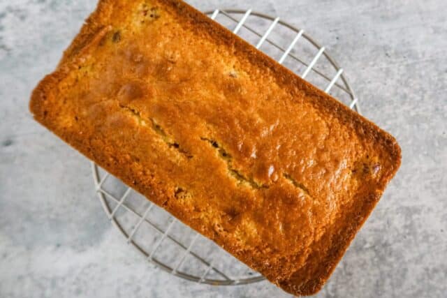 A baked loaf of cranberry orange bread.