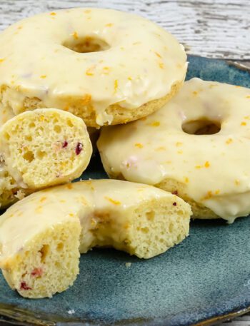 baked cranberry orange donuts on a plate