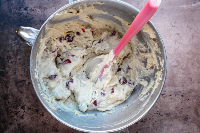 Cranberry muffin preparation; making the batter and folding the cranberries and pecans into it.