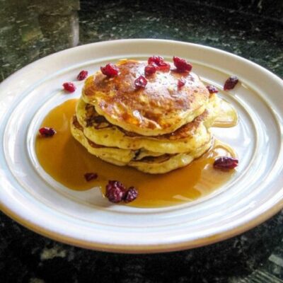 a stack of cranberry pancakes on a plate