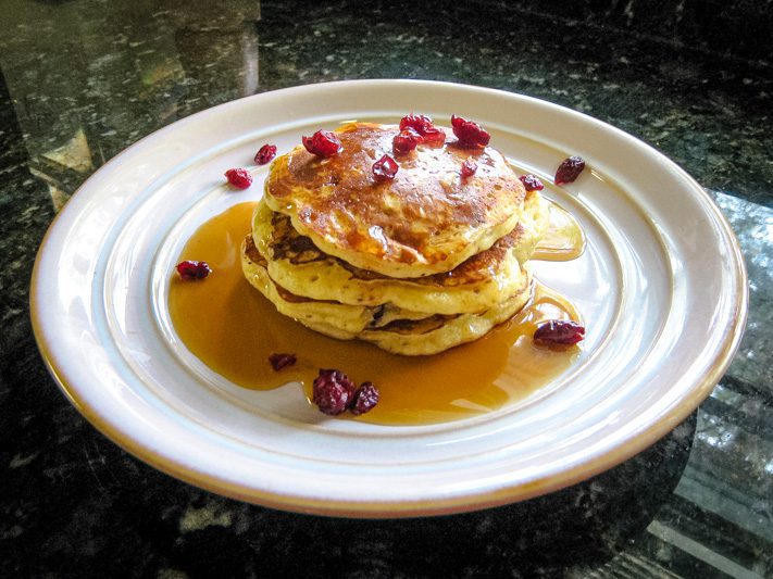a stack of cranberry pancakes on a plate