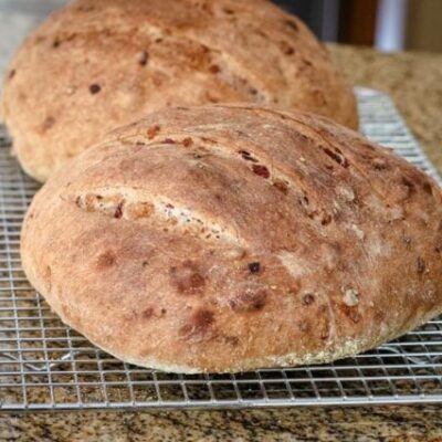 cranberry walnut yeast bread, 2 loaves on a cooling rack