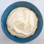 velvety cream cheese frosting in a bowl