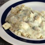 chicken and mushrooms in a creamy sauce on a plate