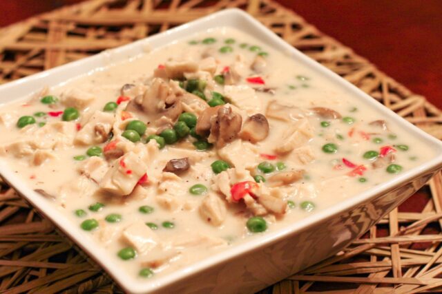 A serving dish with creamed chicken