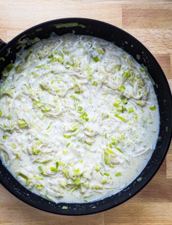 Add the cream and Parmesan cheese to the leeks and add salt and pepper to taste. Time to serve!