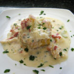 creamed lobster over puff pastry shells with parsley