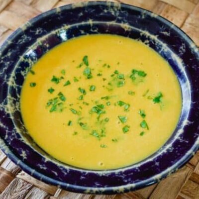 butternut squash soup in a wide pottery bowl